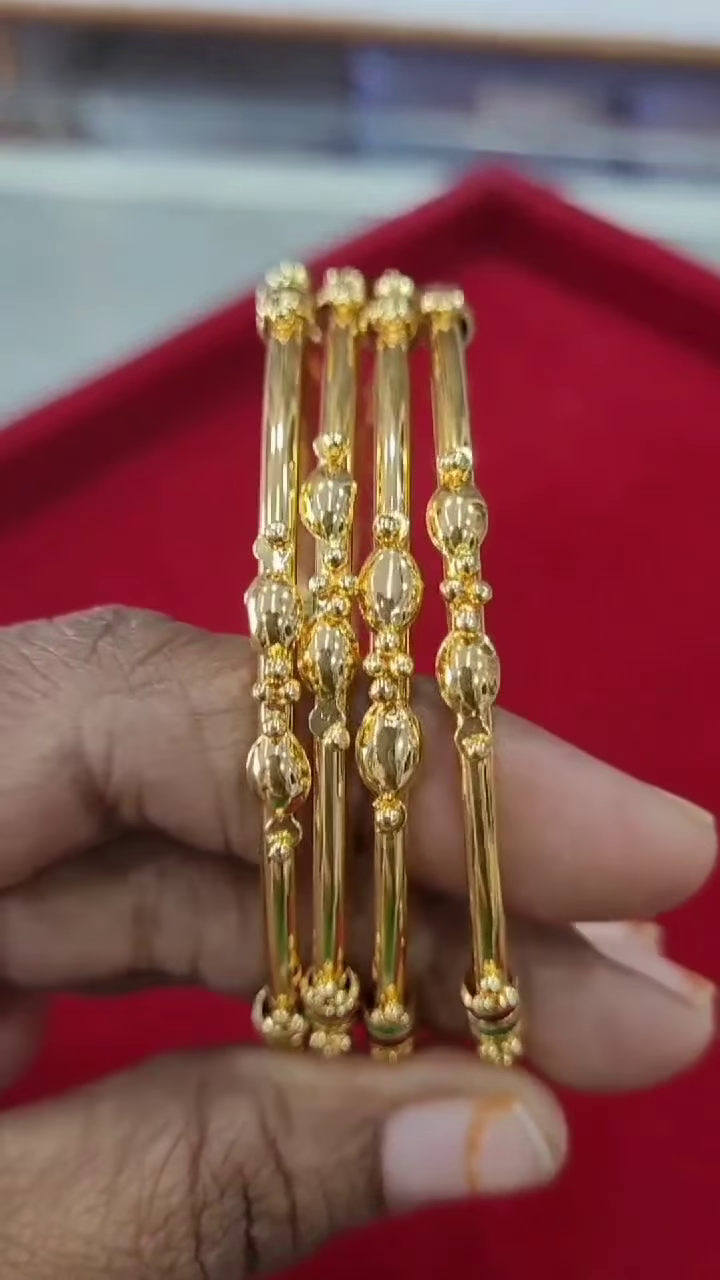 Set of Four Traditional Gold-Plated Bangles with Enamel and Bead Accents - Image 2