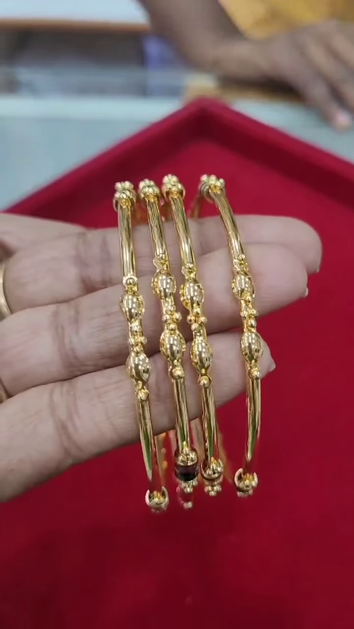 Set of Four Traditional Gold-Plated Bangles with Enamel and Bead Accents - Image 3